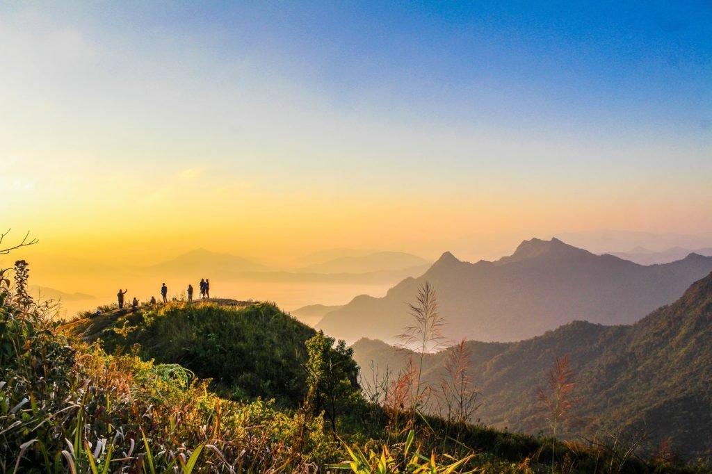 Photo Of People Standing On Top Of Mountain Near Grasses 733162 1024x682 2